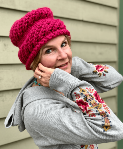 Image of a handknit beenie women's hat in hot pink.